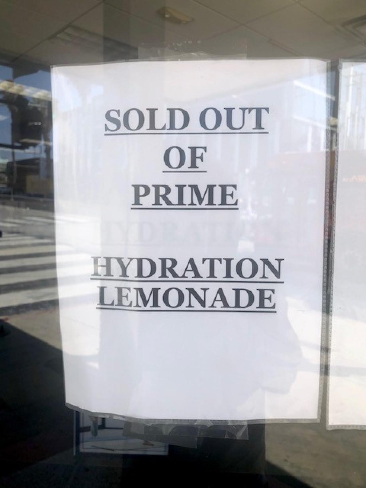 Store sign in window in All CAPS: Sold out of Prime Hydration Lemonade