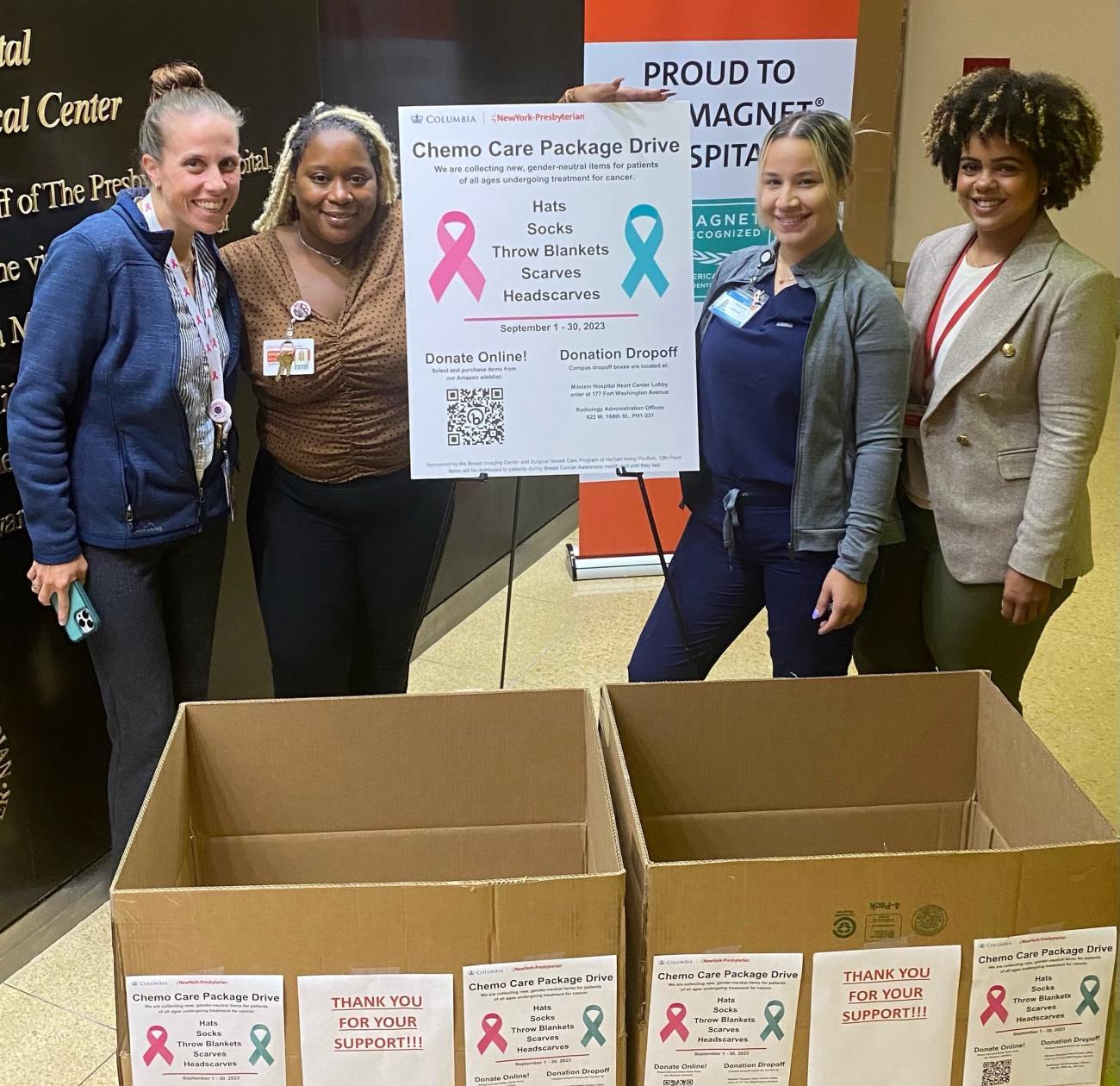 Columbia radiology and surgery staff members next to collection boxes for chemo care drive