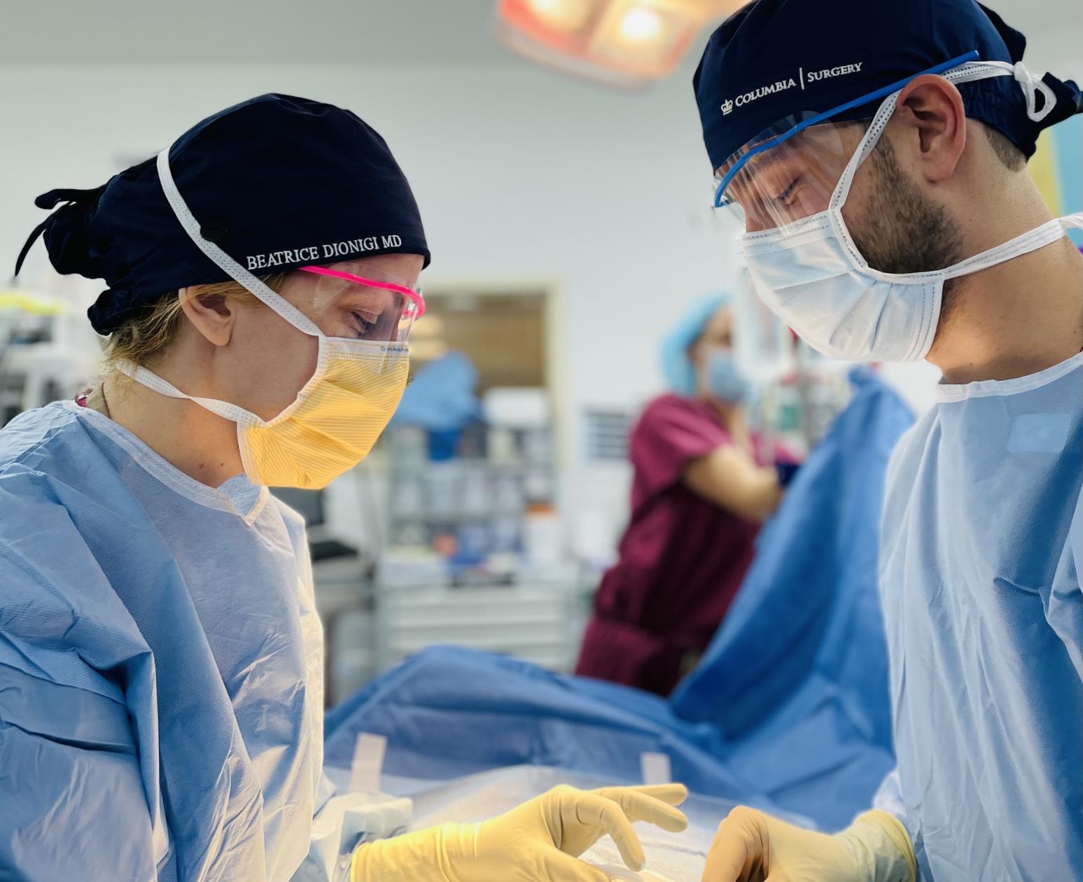 two surgeons in scrubs in the operating room