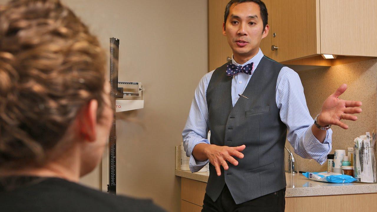 Dr. Arnold Advincula speaking with a patient