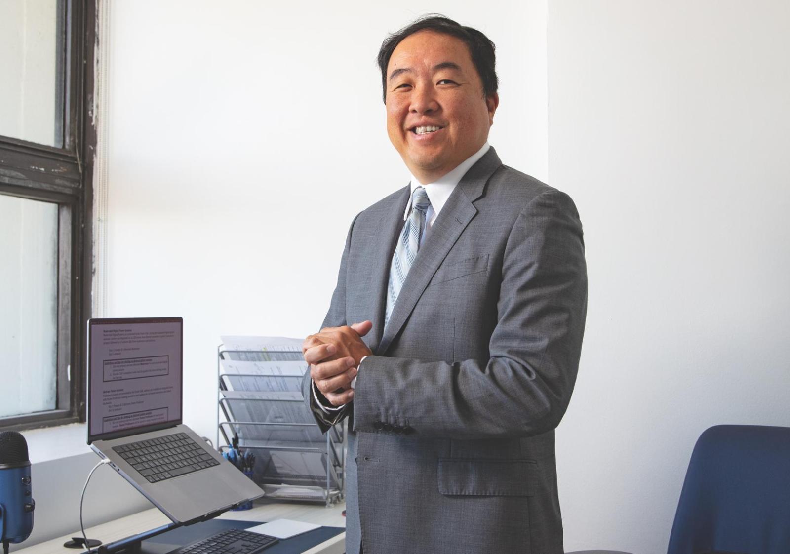 Daichi Shimbo standing in his office