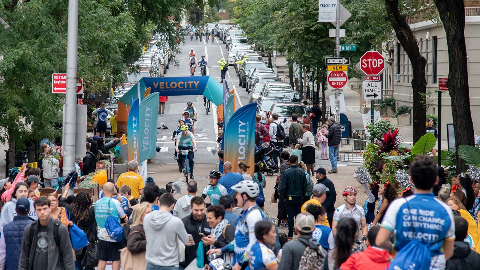Velocity riders cross the finish line.