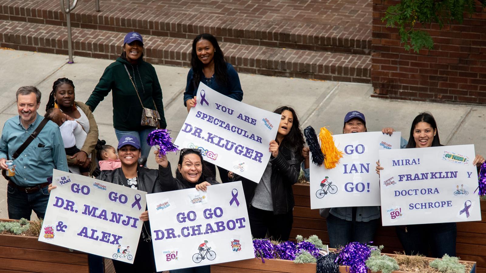 Velocity supporters cheer on riders.