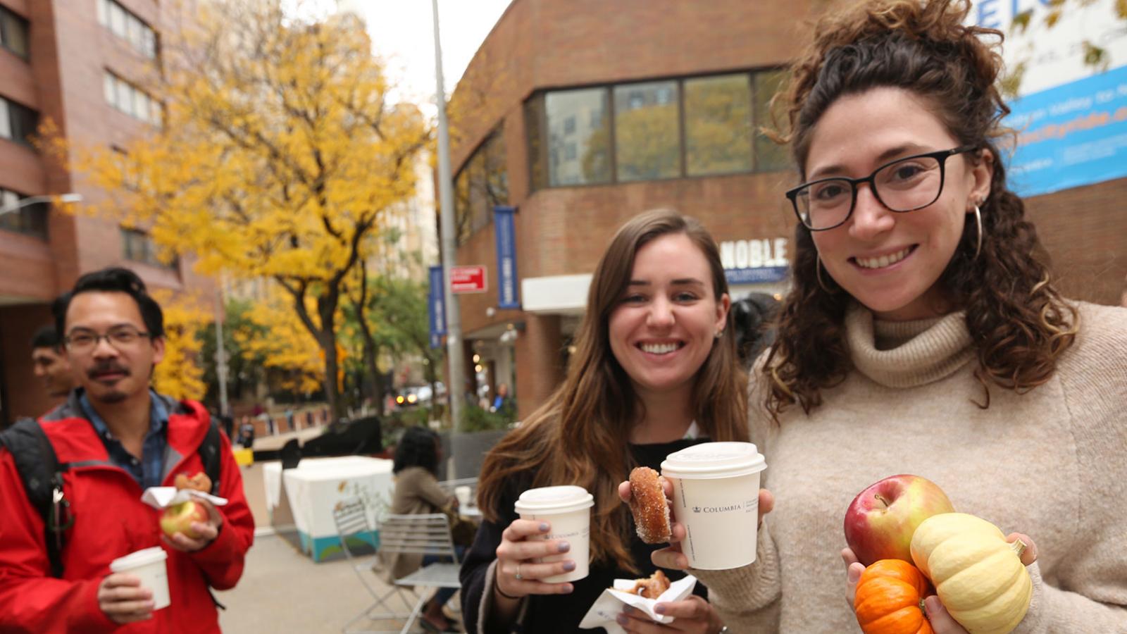 Columbia employees gather in Haven Plaza for an autumnal Welcome Haven event.