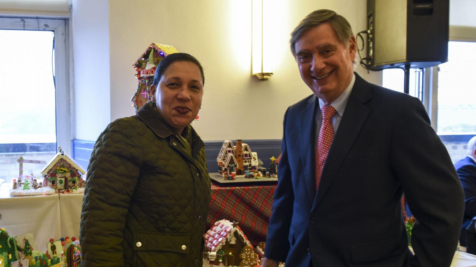 Dean Goldman is pictured with a member of the CUIMC Housing and Campus Operations Office, which won 3rd Place/Honorable Mention in a gingerbread house-making contest.
