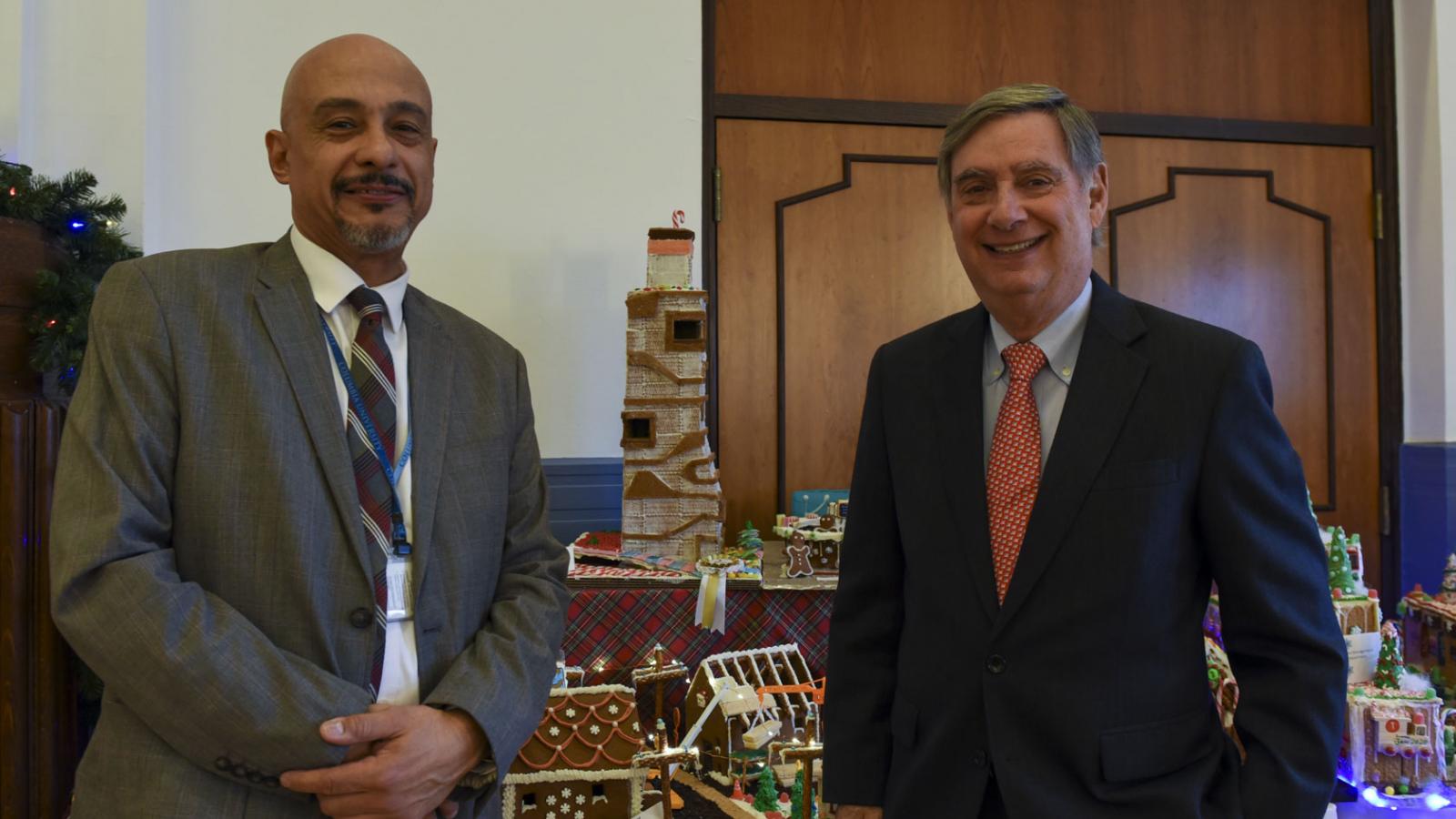 Dean Goldman is pictured with a member of the CUIMC Facilities – Engineering team, which won 3rd Place in a gingerbread house-making contest.