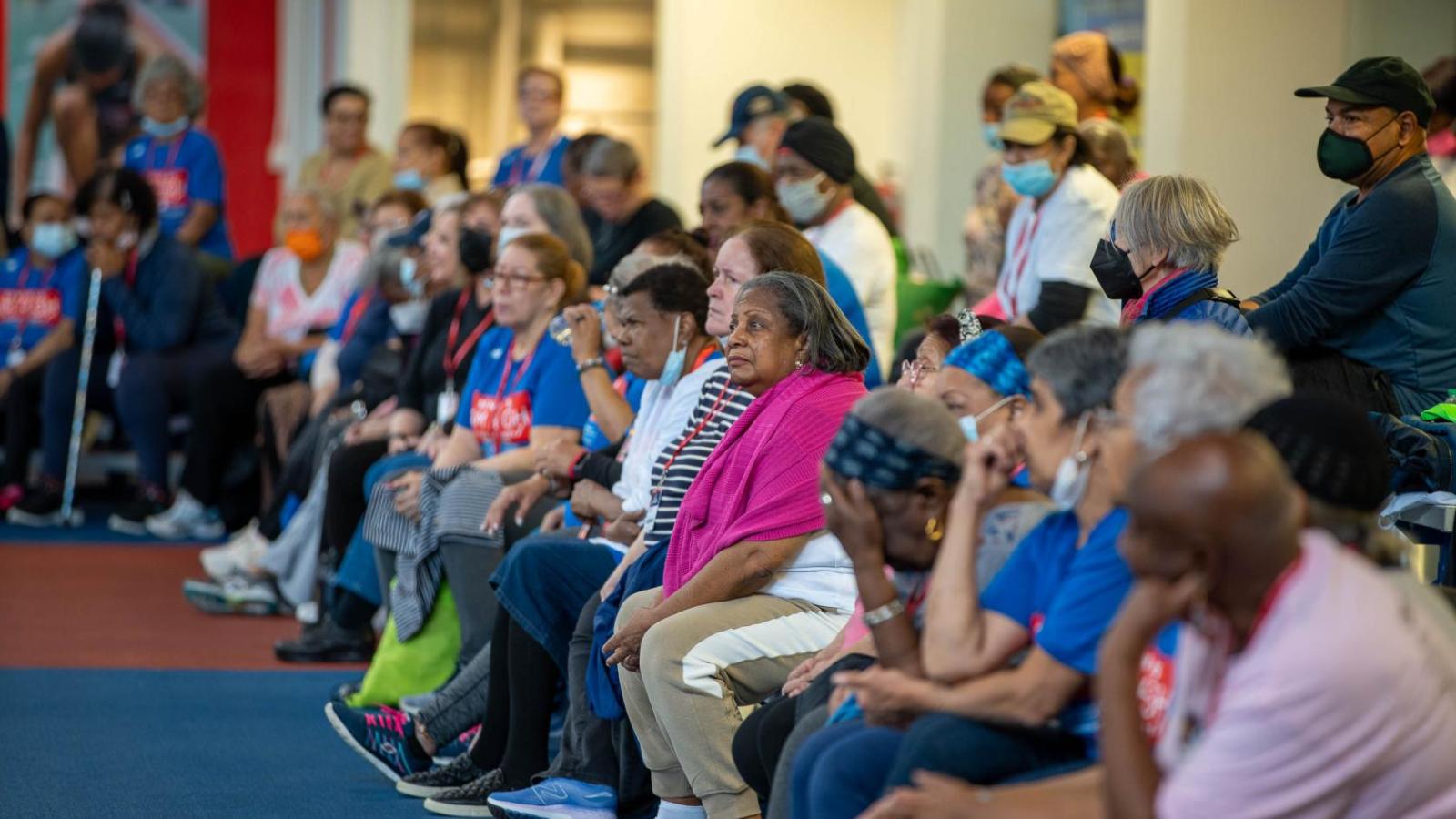 Seniors listen to a presentation by a doctor