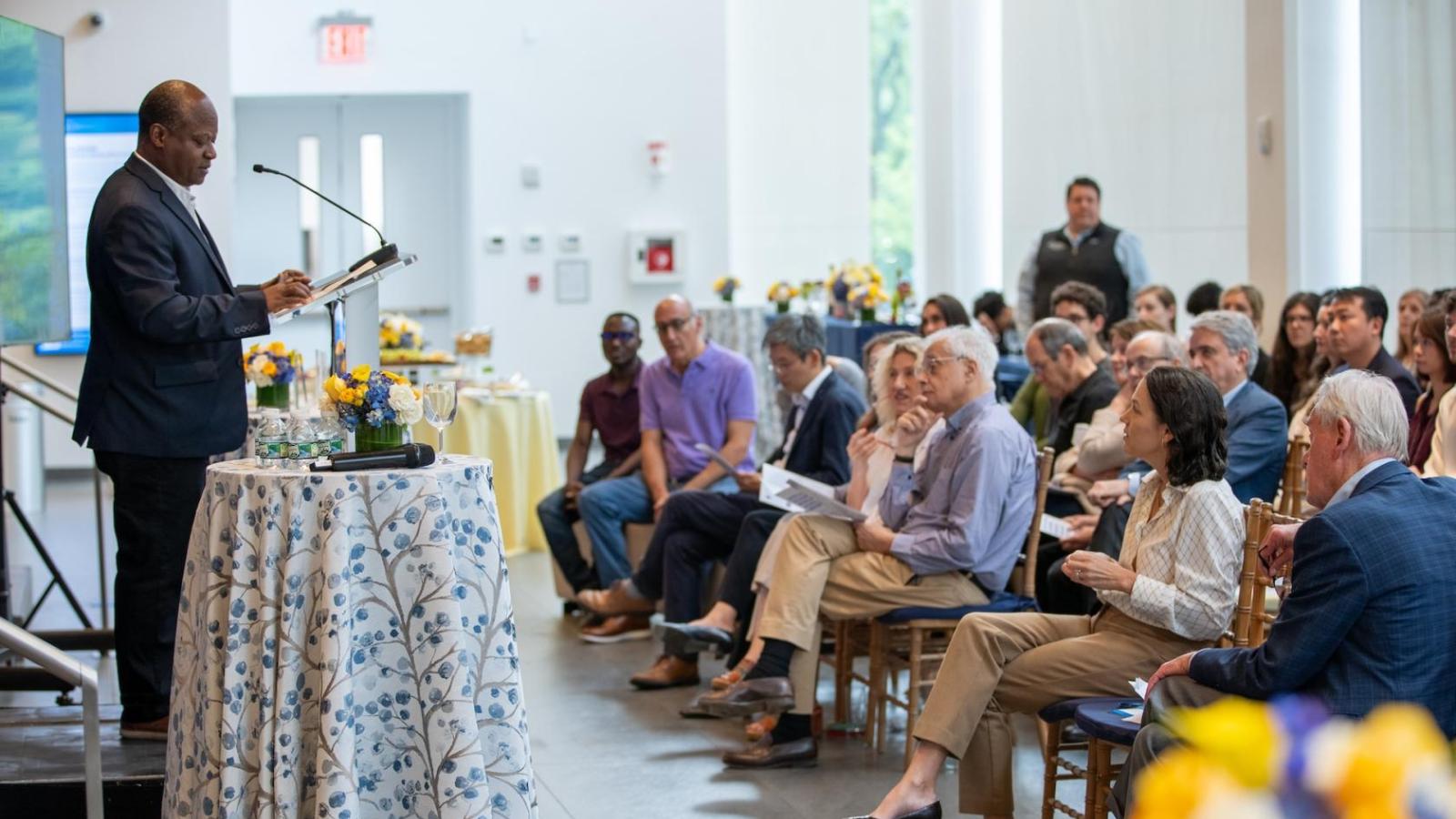 Henry Colecraft speaking at a podium