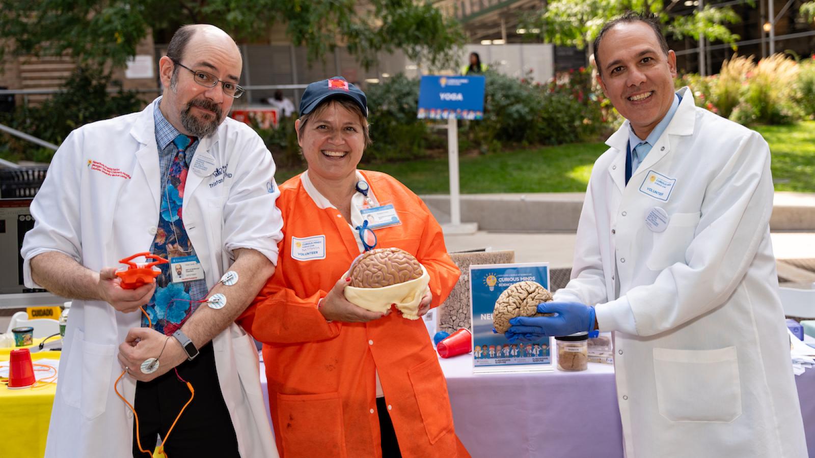 volunteer scientists at science fair