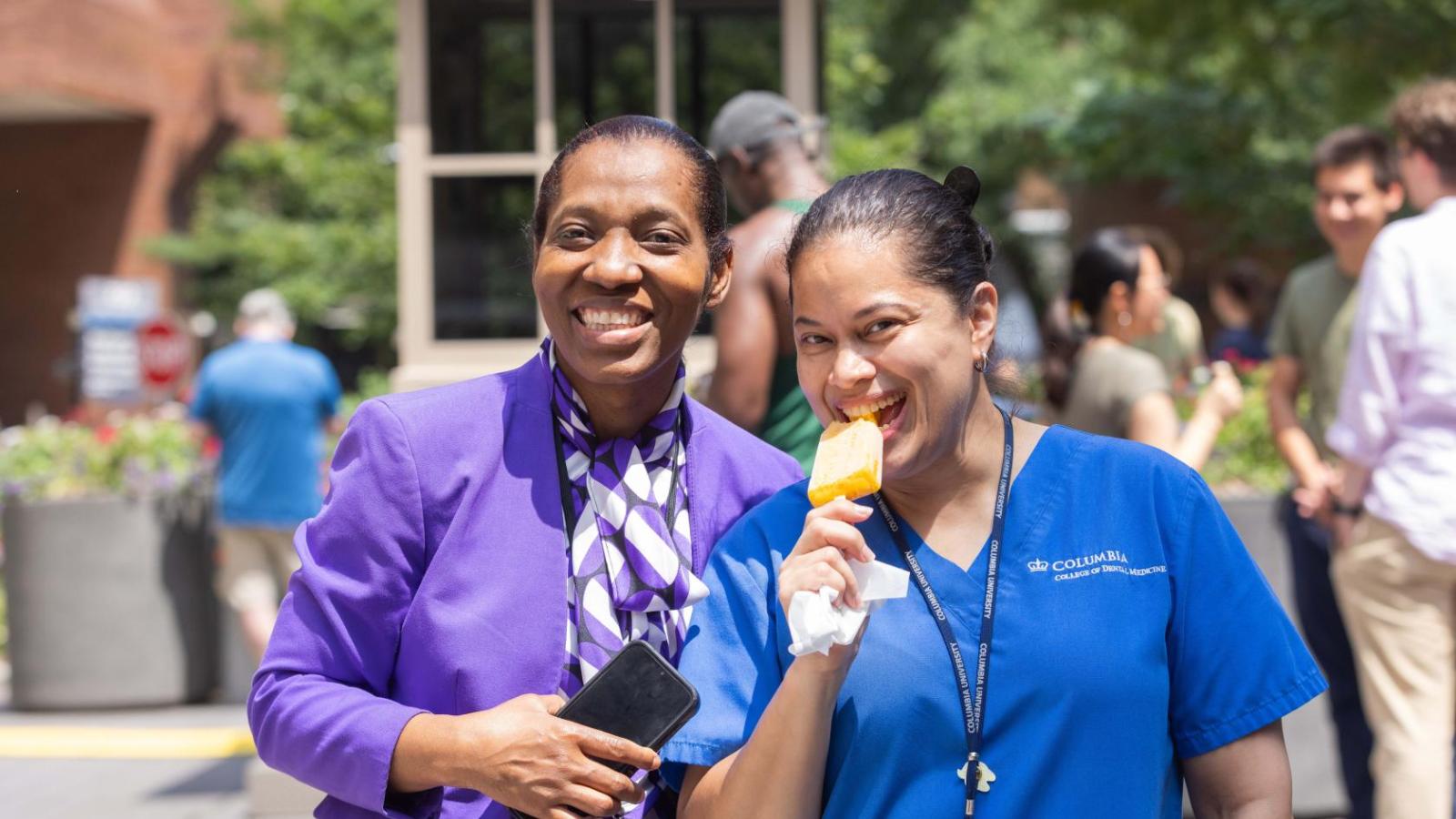 Two women pose with ice cream