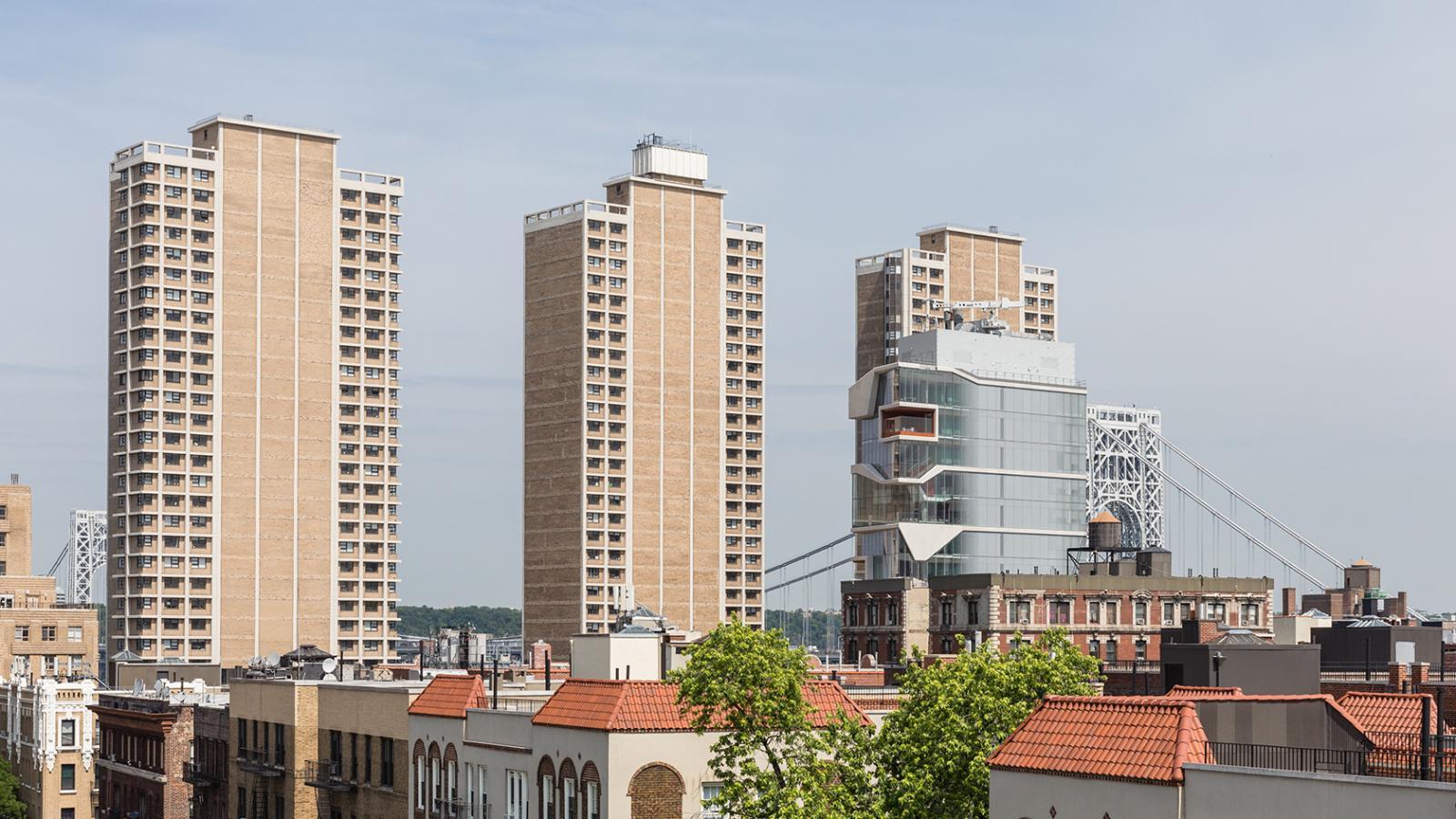 View of the Vagelos Education Building and Towers 1, 3, and 3, and the George Washington Bridge in the background. Photo Credit: Pavel Bendov