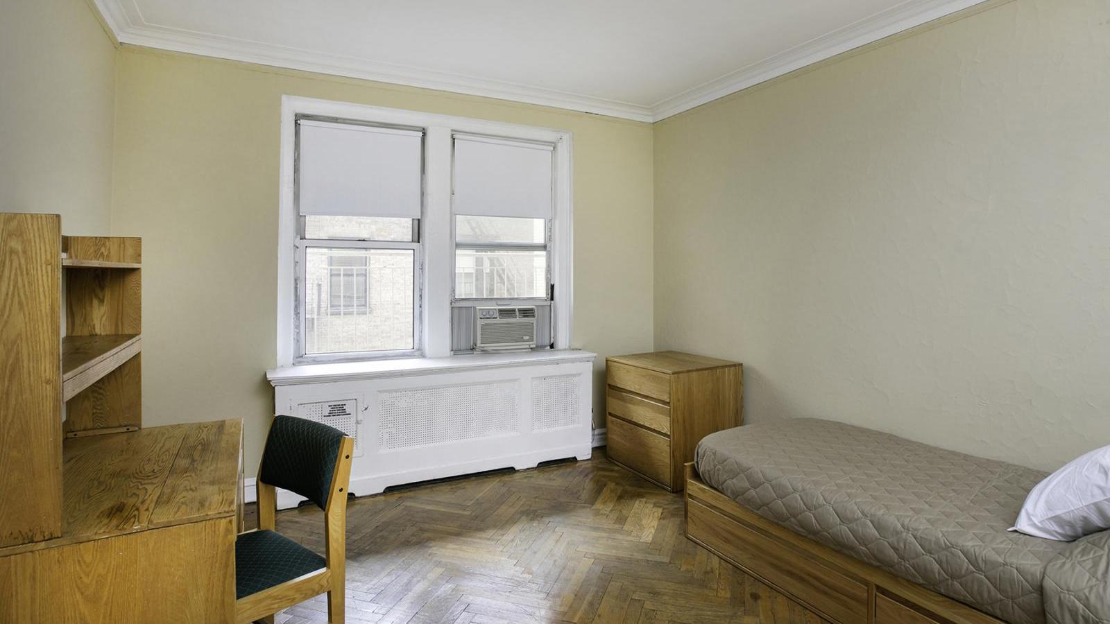 View of a sample bedroom in the Georgian Residence, showing the window view.
