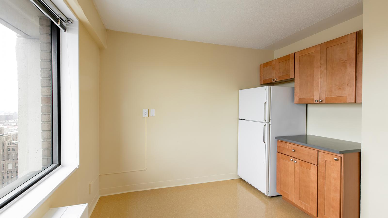 View of a sample kitchen in an “A” Apartment (29A) in Tower 1, view 2.