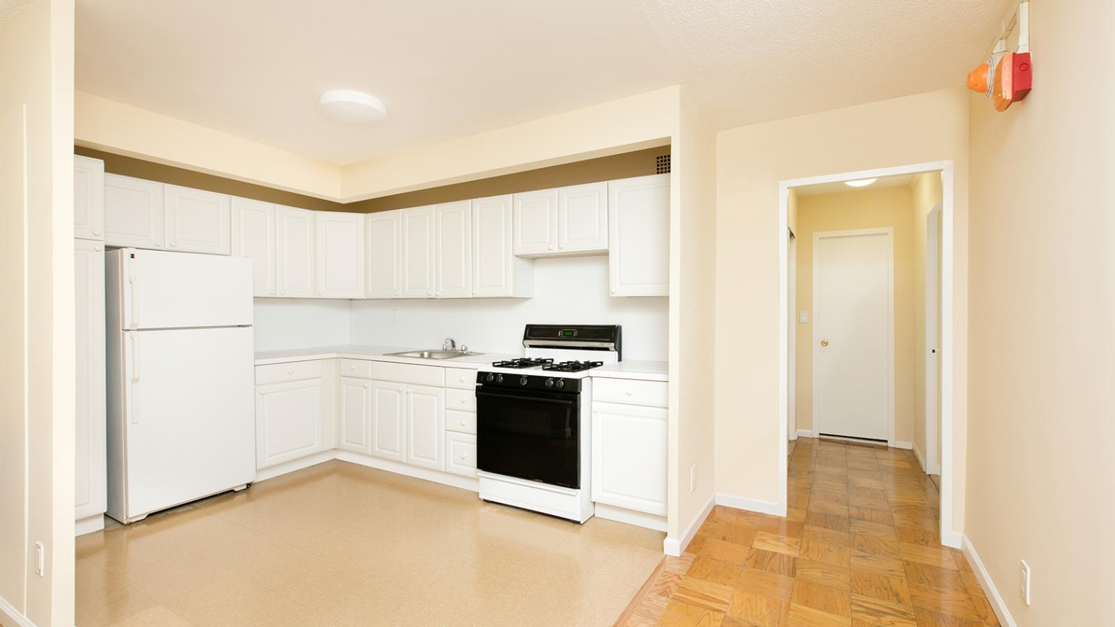View of a sample kitchen version 2 in a “B” Apartment (5B) in Tower 1.