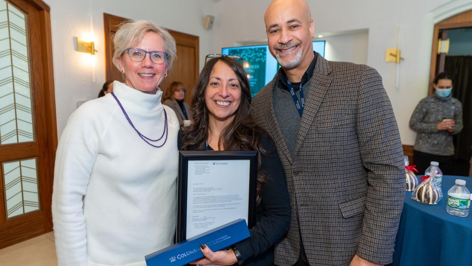 baton award winner with friends