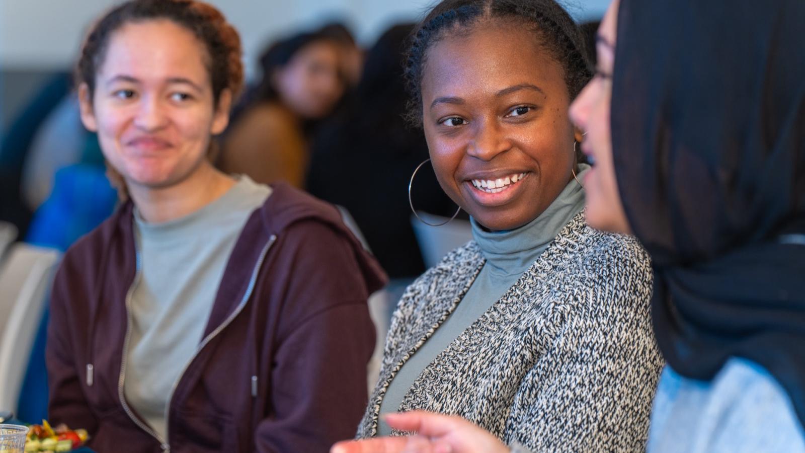 people chatting and smiling