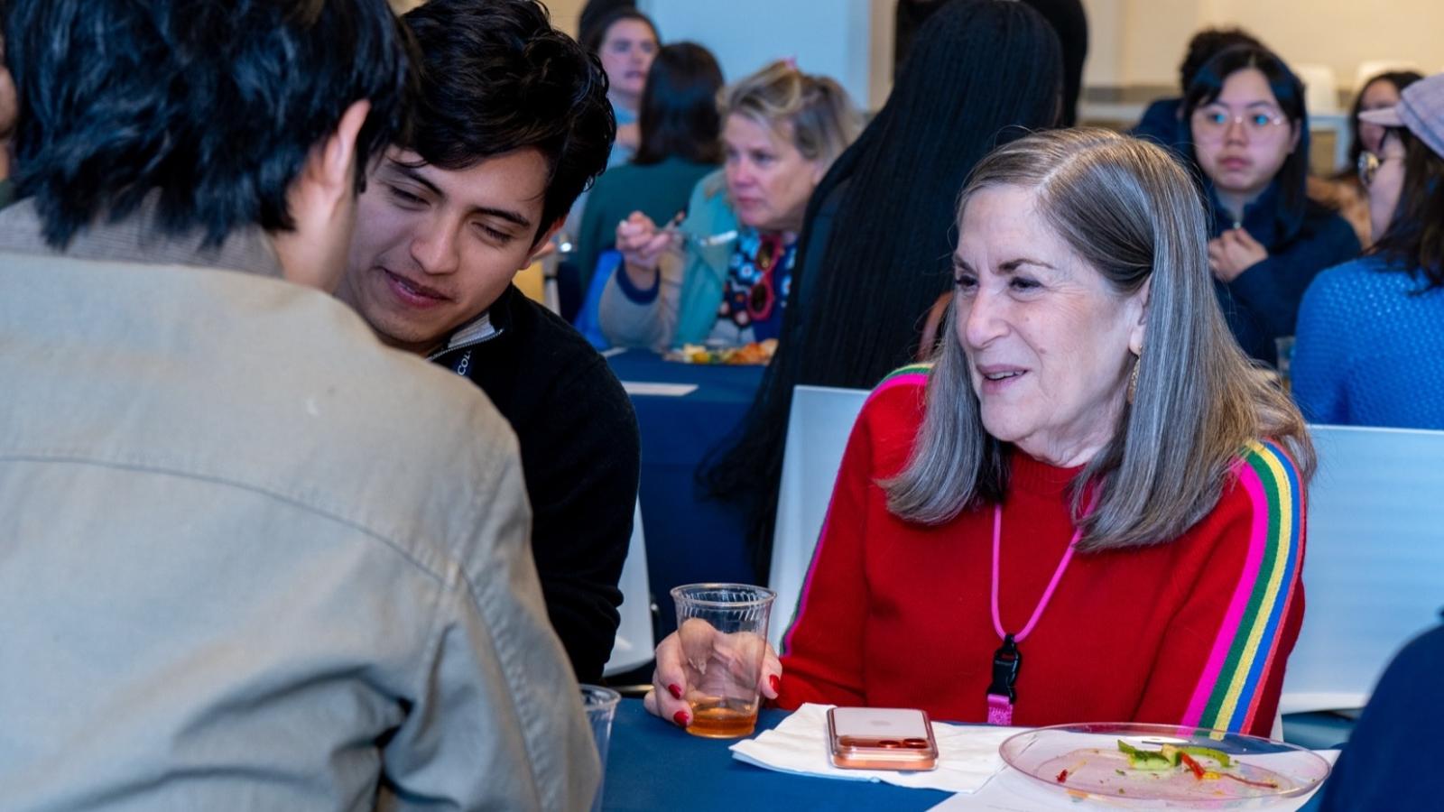 people at dinner table chatting