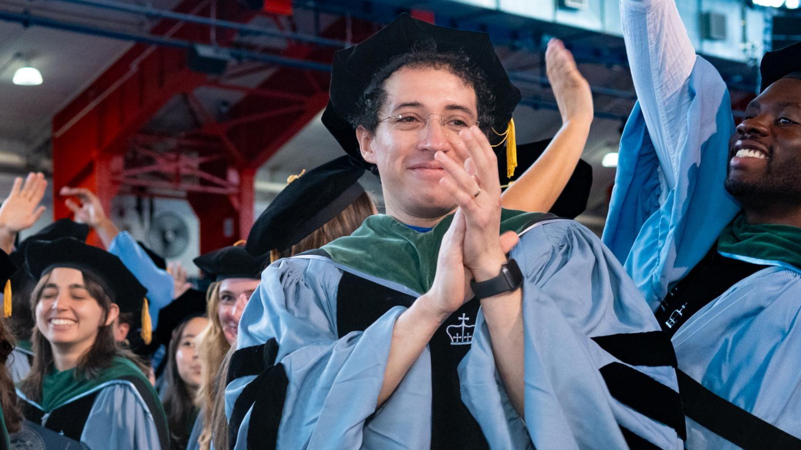 graduates celebrating with clapping