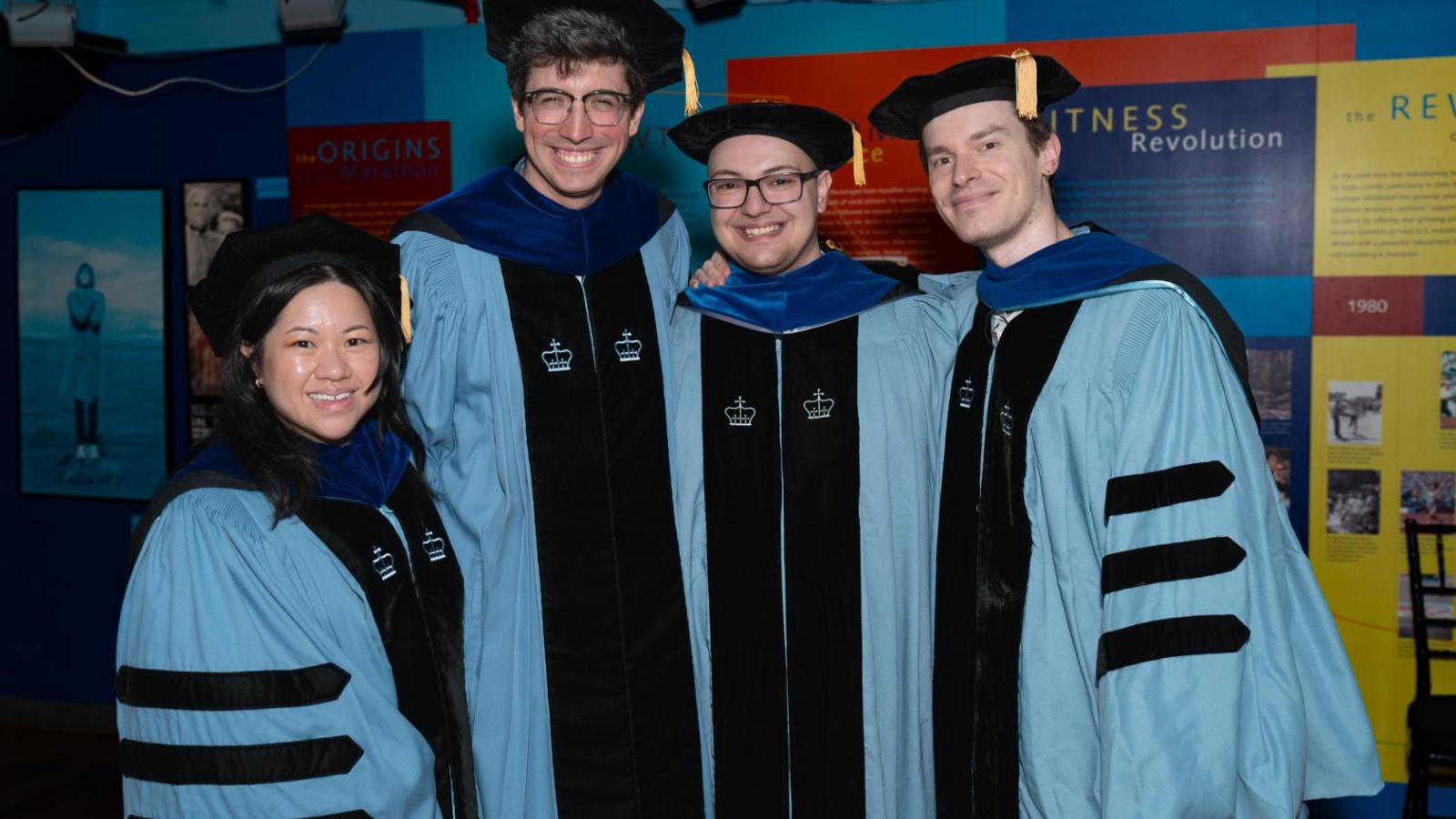 VP&S PhD graduates in their academic robes during graduation ceremony