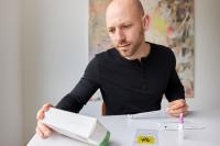 man reading instructions for an at-home covid test