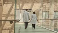Doctors walking down hospital hallway
