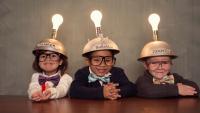 This young group of students are glowing in knowledge; children Wearing Lighted Mind Reading Helmets.