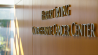 sign on wall that says Herbert Irving Comprehensive Cancer Center