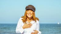 woman smiling at the beach