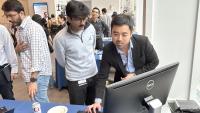 people looking at a computer screen