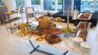 A table setup with various dishes and food for a catering event