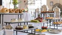 A table setup with various dishes and food for a catering event