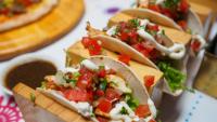 3 tacos on a plate at a local restaurant in Washington Heights