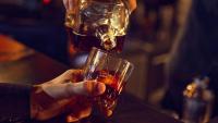 alcohol being poured into a glass