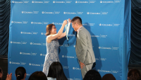 a nursing student is given a pin to mark the beginning of his nursing education