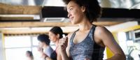 Women running on treadmills at a gym