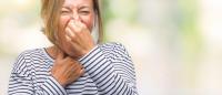 woman reacting to foul odor / Getty Images