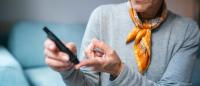 older woman checking her glucose levels