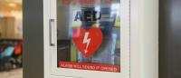 Automated external defibrillator on the wall. AEDs are used for cardiac arrest heart attacks.