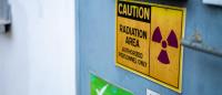 yellow radiation warning sign in a workplace