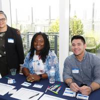 CUIMC HR stuff smiling at their booth